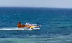 Denizden su alan uçağın olumsuz hava şartları nedeniyle kalkış yapamadığı anlar kamerada