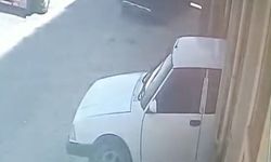 Kaporta ustası tamir etmek istediği otomobilin altında kaldı; o anlar kamerada