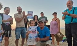 Kuşadası'nda caretta caretta yavruları denizle buluştu