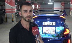 Televizyon koyup şelale oluşturduğu aracının bagajında, akvaryumda balık besliyor