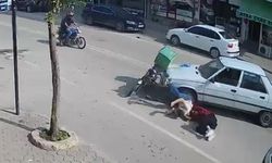 Otomobil ile çarpışan motosikletteki çift yaralandı; kaza kamerada